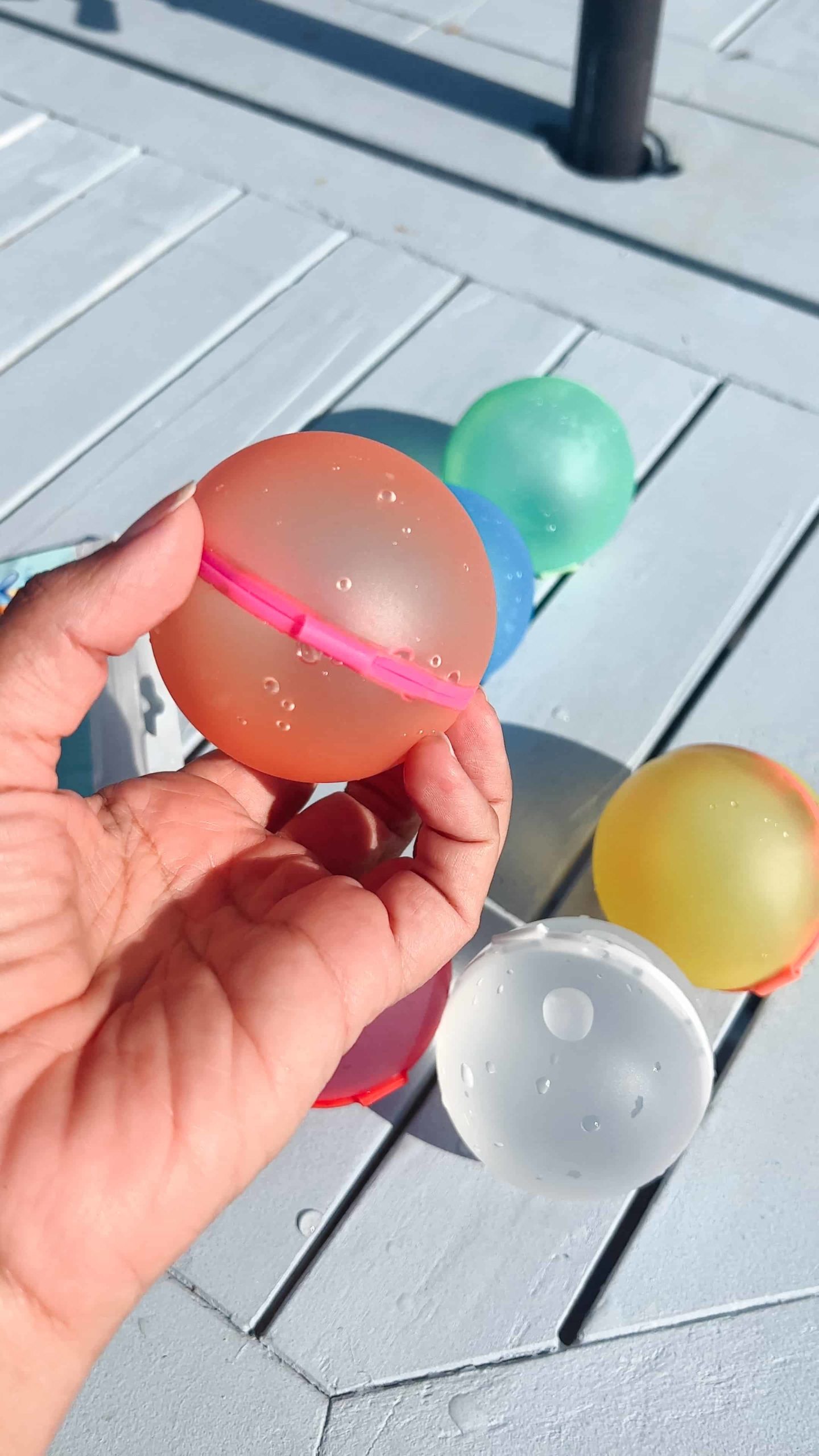 Colorful reusable water balloons piled up, ready for a fun-filled summer splash game.